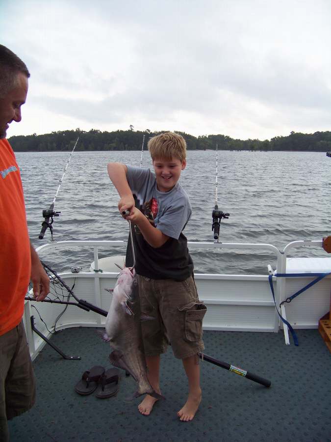 JAMES' SON WITH THE FIRST OF 14 FISH FOR THE MORNING..8-23-08