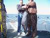 CHARLES HELPING HIS  DAD HOLD HIS BIGGEST FISH OF THE DAY AT 36 POUNDS!  HARD TO BEAT  THAT FOR 79 YEARS YOUNG!  1-31-09