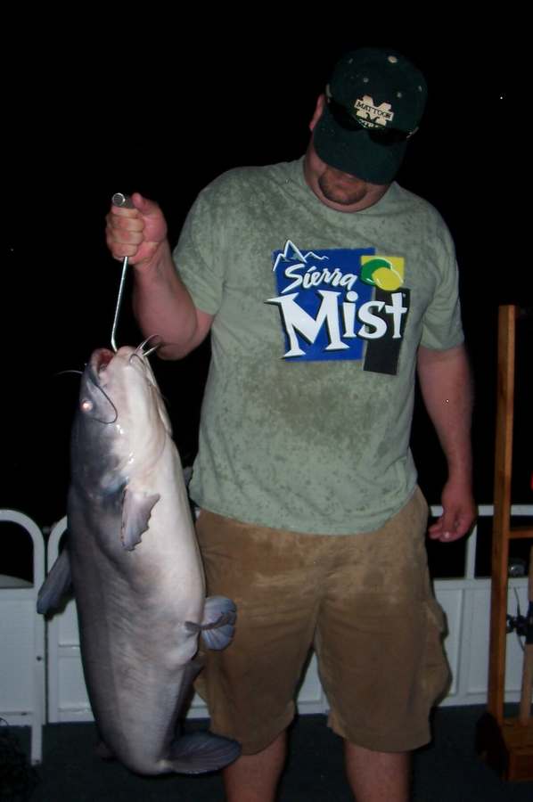 BLAKE WITH THE BIGGEST OF 18 FISH FOR THE NIGHT, A 36LB. BLUE!       6-27-08