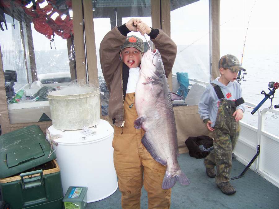 Hart holding up his biggest fish of the day at 23.5 pounds!  12-6-08