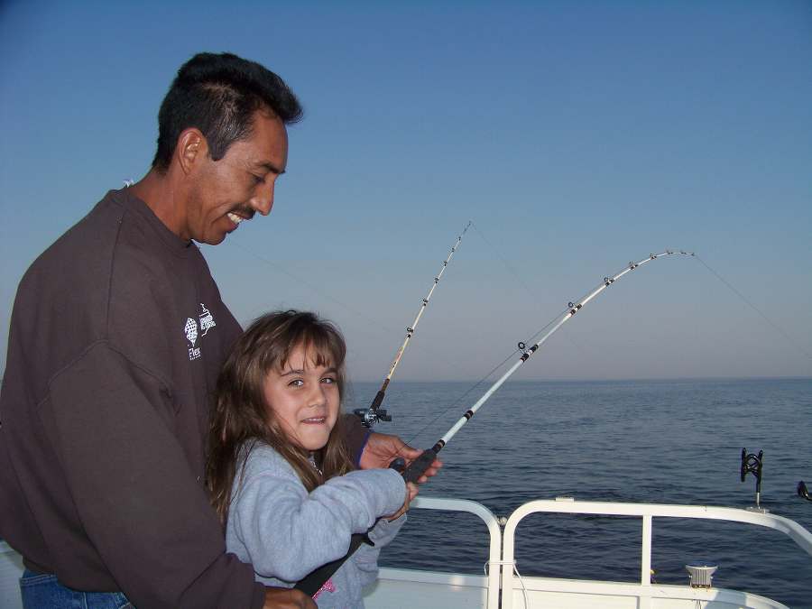 HANNA FIGHTING HER FIRST FISH OF THE DAY WITH A LITTLE HELP FROM DAD!  10-4-08