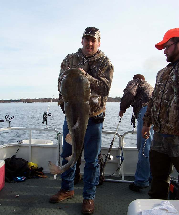 STEVE WITH HIS 30LB.+ FLAT HEAD.  12-13-08