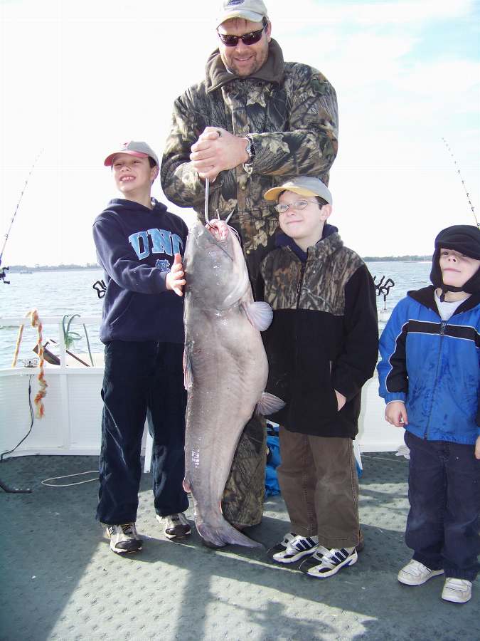 STAN AND HIS BOYS SHOW OFF THE BIGGEST OF 17 FISH FOR THE DAY AT 34LBS.  2-1-09