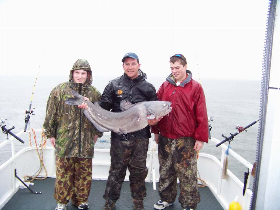 ME HOLDING RICHARD'S 45 POUNDER.  THIS FISH WAS RELEASED UNHARMED 2-14-09