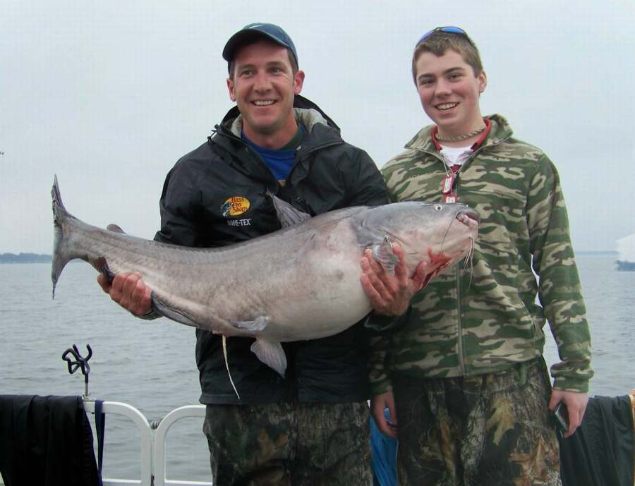 ME AND DALTON WITH HIS 51 POUND BLUE!  NEW BIG FISH FOR 2009.  2-14-09  THIS FISH WAS RELEASED ALONG WITH A 45 POUNDER AND A 31 POUNDER.  CHECK HIM OUT ON VIDEO CLIPS