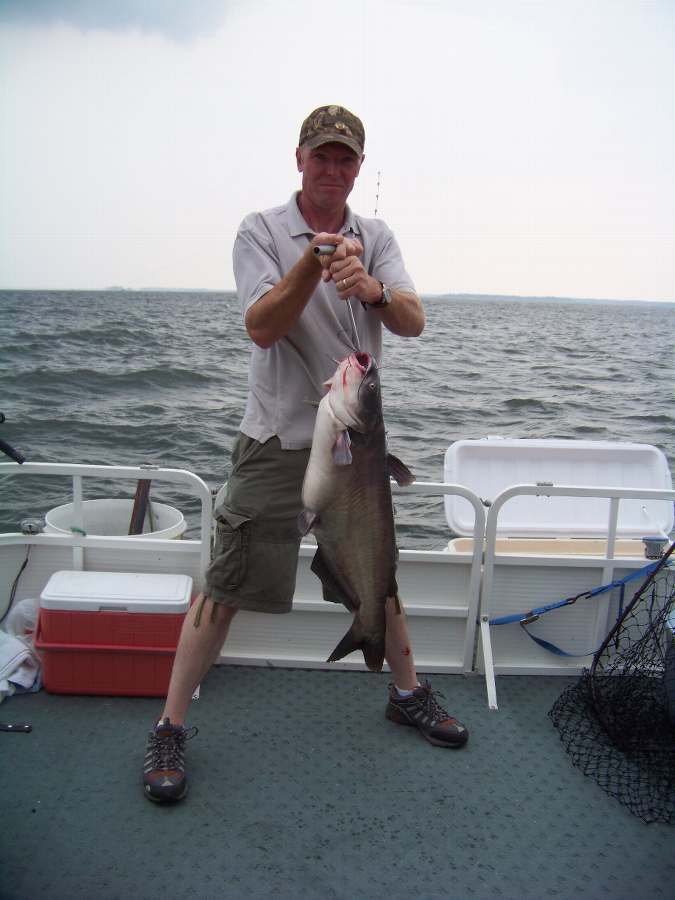 SCOTT WITH THE FIRST FISH OF THE NIGHT, A 20LB. BLUE.  8-16-08