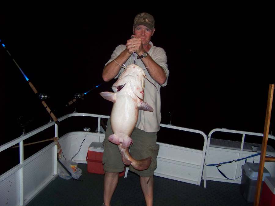 SCOTT WITH THE BIGGEST FISH OF THE NIGHT AT 26LBS.     8-16-08