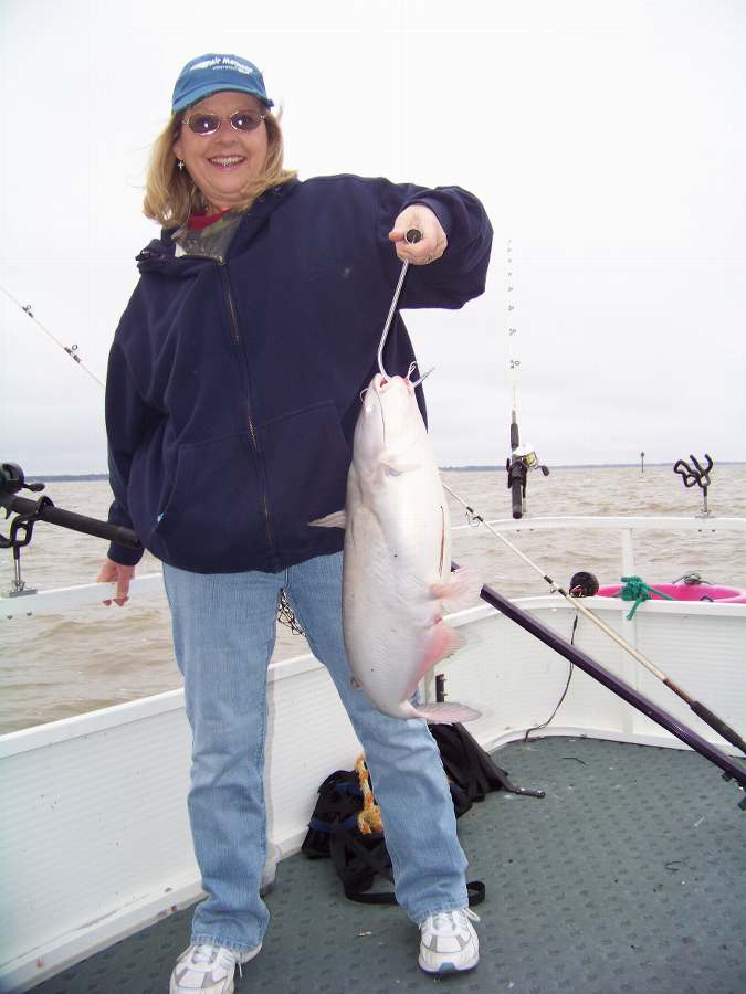 MISS BARB WITH THE FIRST OF 9 FISH FOR THE DAY AS THE WINDS AND RAIN CONTINUE!  1-23-10