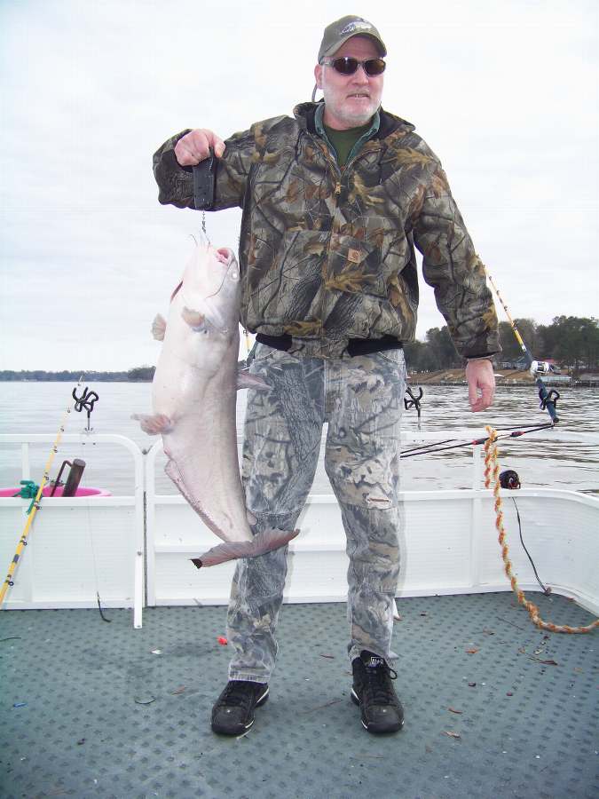 DONNIE WITH THE BIGGEST OF 9 FISH FOR THE DAY AT 23 LBS. ON 1-23-09  ALL OF THE FISH WERE RELEASED