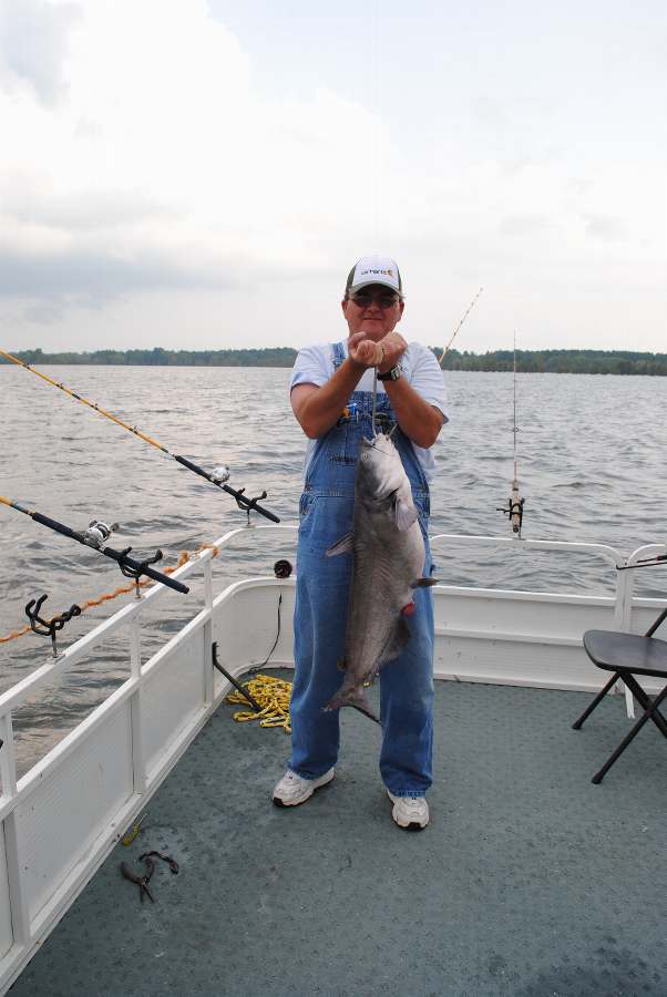 UNCLE CHARLIE WITH ONE OF 3 FISH OVER 20 LBS. ON 8-25-10